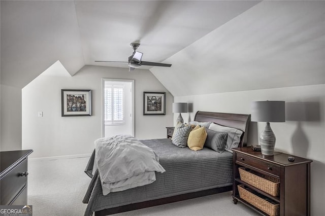 carpeted bedroom featuring lofted ceiling, a ceiling fan, and baseboards