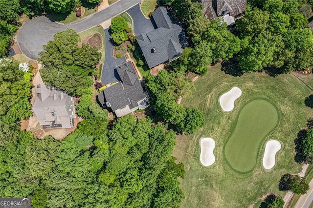 view of property location with a golf club