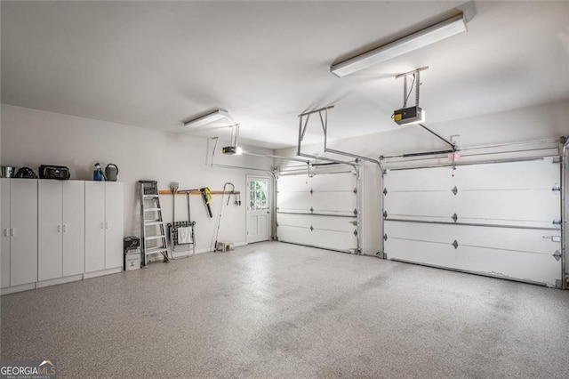 garage featuring a garage door opener