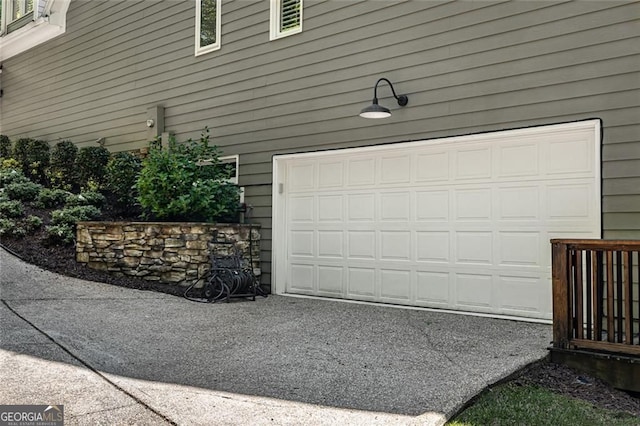 garage with asphalt driveway