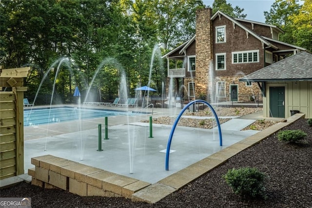view of home's community featuring a pool