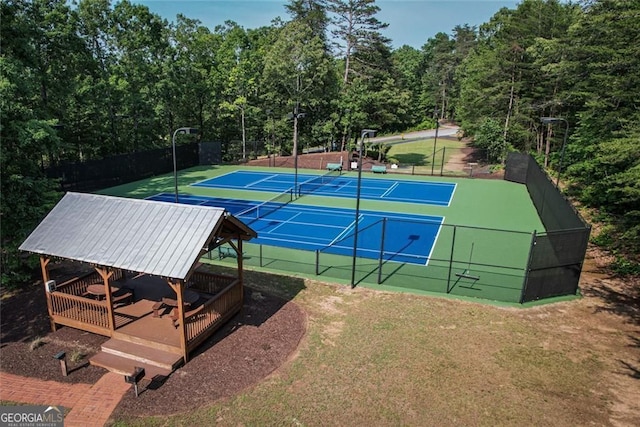 view of sport court featuring a tennis court