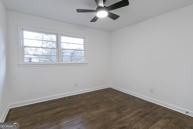 3215 Pennignton Cir, Atlanta, GA 30354 - spare room featuring dark wood-type flooring, baseboards, and a ceiling fan