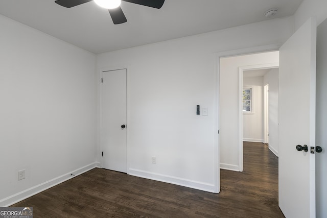 3215 Pennignton Cir, Atlanta, GA 30354 - empty room featuring ceiling fan, a smoke detector, dark wood-style flooring, and baseboards