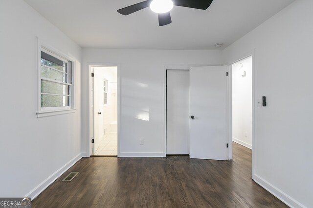 3215 Pennignton Cir, Atlanta, GA 30354 - unfurnished bedroom with dark wood-style floors, baseboards, a closet, and ensuite bathroom