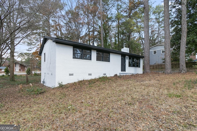 3215 Pennignton Cir, Atlanta, GA 30354 - view of front facade featuring crawl space and a chimney