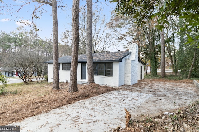 3215 Pennignton Cir, Atlanta, GA 30354 - single story home with a chimney, brick siding, and a shingled roof