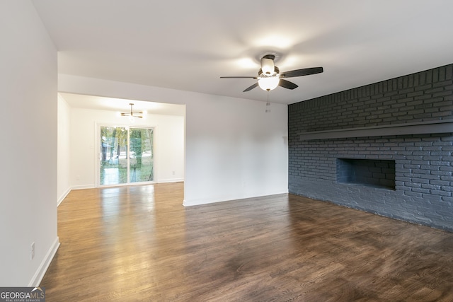 3215 Pennignton Cir, Atlanta, GA 30354 - unfurnished living room with ceiling fan, wood finished floors, baseboards, and a brick fireplace