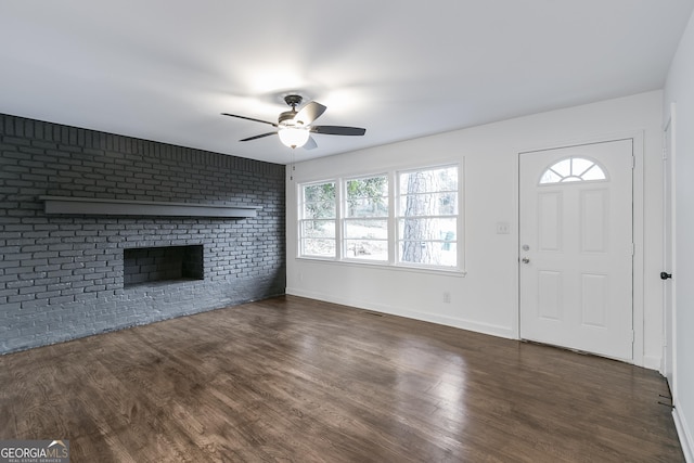 3215 Pennignton Cir, Atlanta, GA 30354 - unfurnished living room with a ceiling fan, wood finished floors, a fireplace, and baseboards