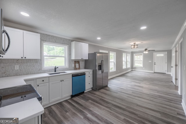 11 Cloverhurst Dr, Toccoa, GA 30577 - kitchen with dishwashing machine, a sink, ornamental molding, stainless steel fridge, and recessed lighting