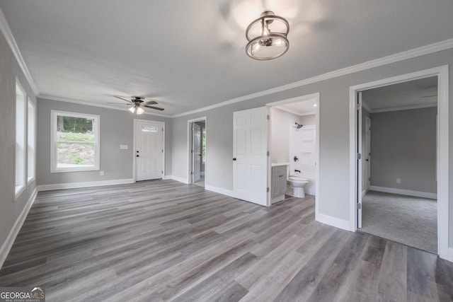 11 Cloverhurst Dr, Toccoa, GA 30577 - unfurnished living room featuring ceiling fan, baseboards, wood finished floors, and crown molding