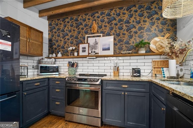 kitchen featuring black appliances, a sink, backsplash, dark wood-style floors, and beamed ceiling