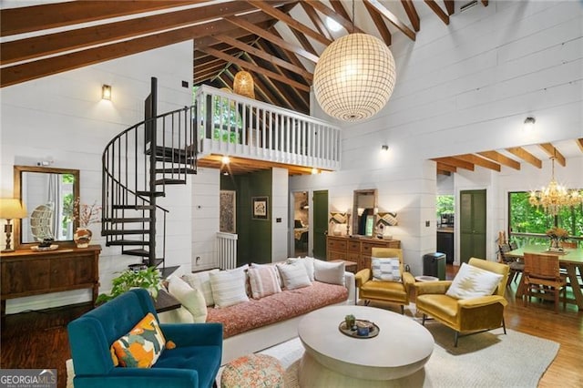 living room featuring high vaulted ceiling, a chandelier, wood finished floors, stairway, and beam ceiling