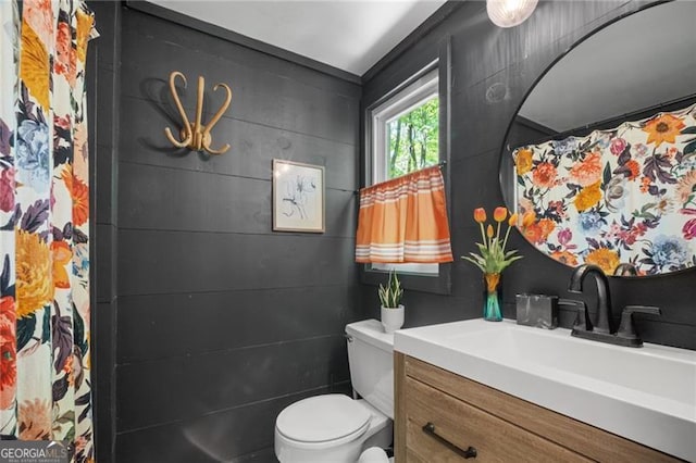 full bath featuring toilet and vanity