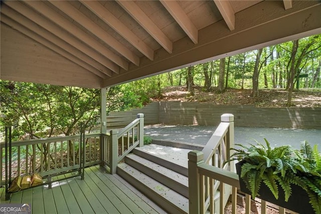 wooden terrace with a patio