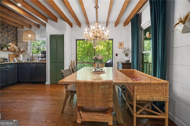 dining space featuring a chandelier, dark wood-style floors, and beam ceiling