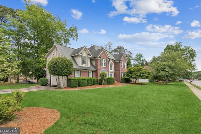 840 Yosemite Dr, Suwanee, GA 30024 - view of front of home featuring a front yard and brick siding