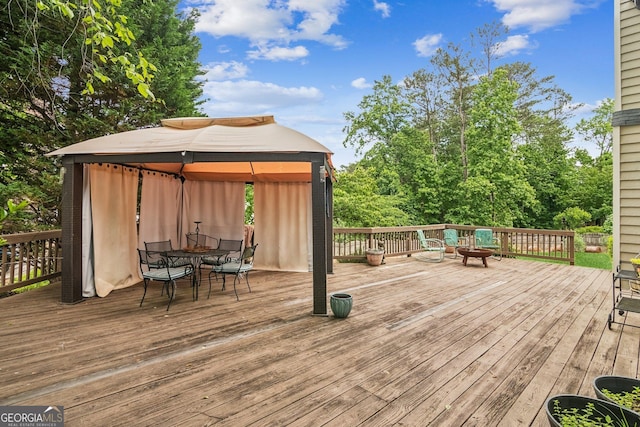 840 Yosemite Dr, Suwanee, GA 30024 - wooden terrace featuring a gazebo and outdoor dining area