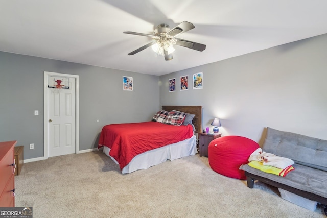 840 Yosemite Dr, Suwanee, GA 30024 - carpeted bedroom with baseboards and a ceiling fan
