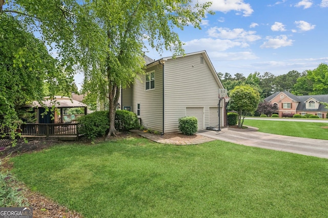 840 Yosemite Dr, Suwanee, GA 30024 - view of side of property featuring a gazebo, driveway, a garage, and a yard