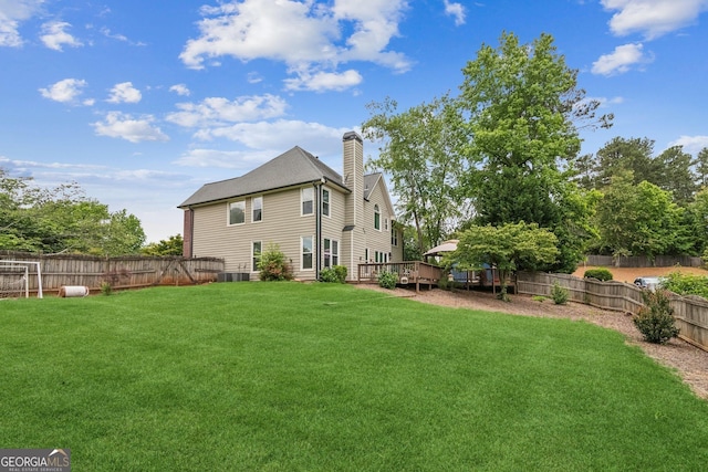 840 Yosemite Dr, Suwanee, GA 30024 - back of house with a chimney and a wooden deck