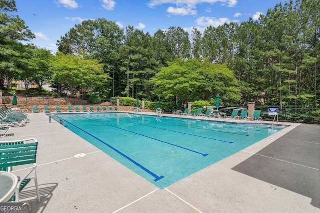 840 Yosemite Dr, Suwanee, GA 30024 - community pool with fence and view of scattered trees