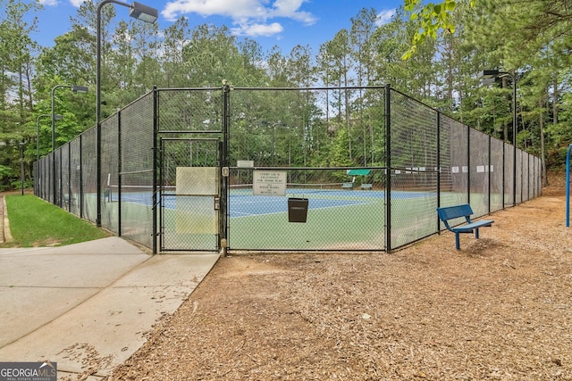 840 Yosemite Dr, Suwanee, GA 30024 - view of sport court featuring a tennis court, a gate, and fence