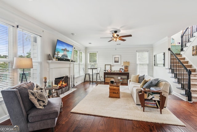 840 Yosemite Dr, Suwanee, GA 30024 - living room with ceiling fan, stairway, a tile fireplace, crown molding, and wood finished floors