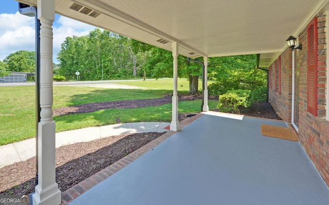 view of patio featuring view of scattered trees