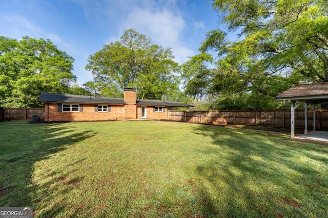 view of yard featuring central AC