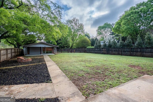 view of yard with view of scattered trees and a patio
