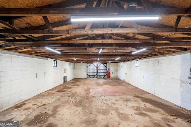 garage with concrete block wall