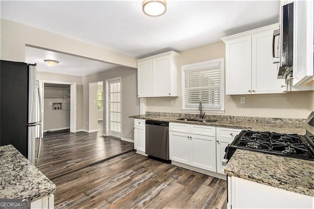 3436 Dodson, Atlanta, GA 30344 - kitchen featuring appliances with stainless steel finishes, a sink, dark wood finished floors, and white cabinets