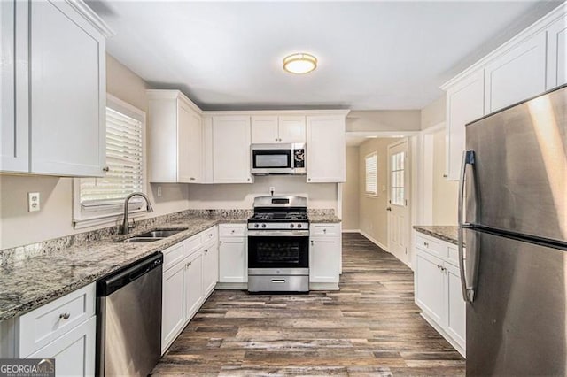 3436 Dodson, Atlanta, GA 30344 - kitchen with stainless steel appliances, a sink, healthy amount of natural light, and white cabinets
