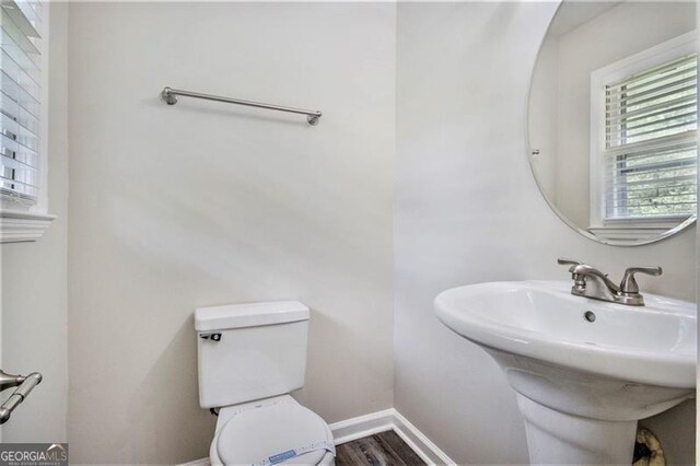 3436 Dodson, Atlanta, GA 30344 - bathroom with toilet, baseboards, wood finished floors, and a sink