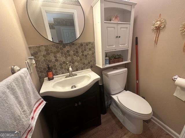 bathroom featuring toilet and vanity