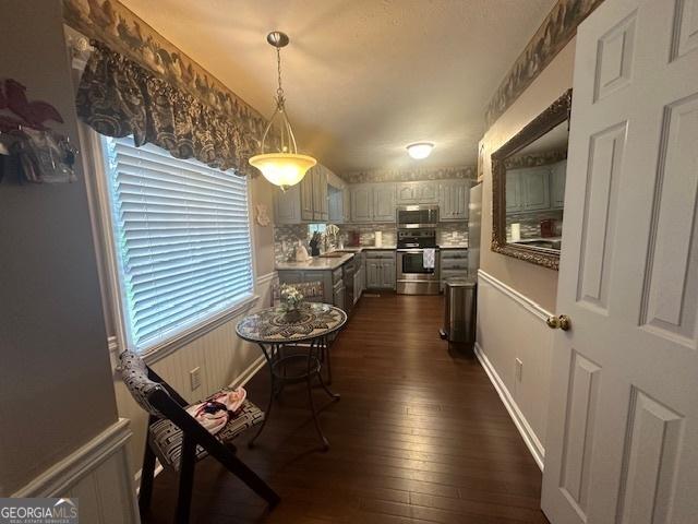 dining area with dark wood-style flooring