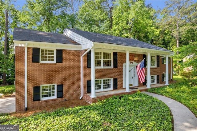 view of front of home featuring brick siding