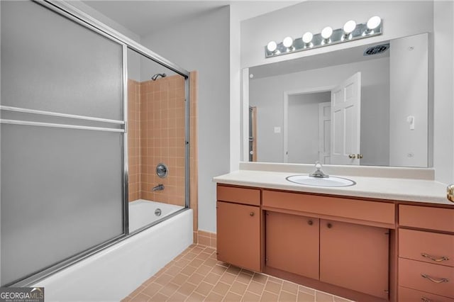 full bathroom with combined bath / shower with glass door and vanity