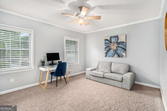 office area with ceiling fan, crown molding, carpet flooring, and baseboards