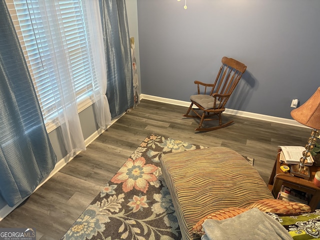 565 Miles Ct, Locust Grove, GA 30248 - living area featuring baseboards and wood finished floors