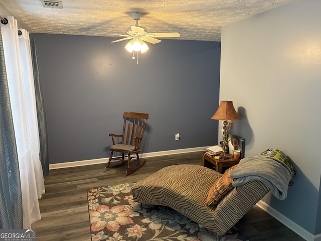565 Miles Ct, Locust Grove, GA 30248 - sitting room with a ceiling fan, baseboards, wood finished floors, and a textured ceiling