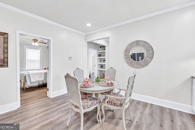11 Poplar St, Porterdale, GA 30014 - dining area featuring baseboards, light wood-style flooring, crown molding, and recessed lighting