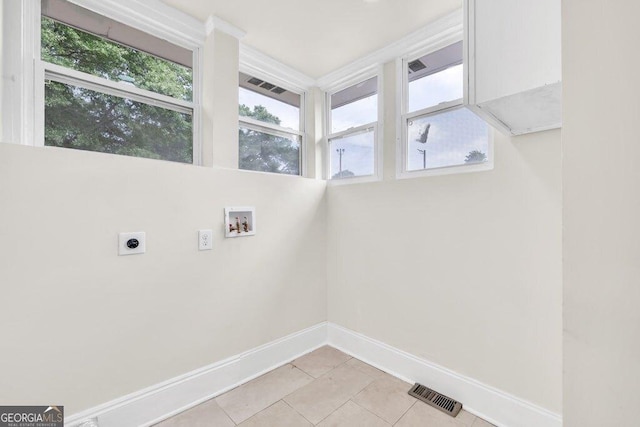11 Poplar St, Porterdale, GA 30014 - washroom with electric dryer hookup, washer hookup, baseboards, light tile patterned floors, and healthy amount of natural light