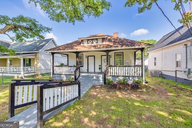 11 Poplar St, Porterdale, GA 30014 - view of front facade featuring a porch, a chimney, and central AC unit