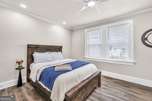 11 Poplar St, Porterdale, GA 30014 - bedroom with wood finished floors, baseboards, a textured ceiling, crown molding, and recessed lighting
