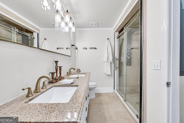 11 Poplar St, Porterdale, GA 30014 - full bath featuring ornamental molding, a stall shower, toilet, double vanity, and tile patterned flooring