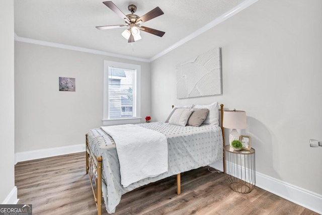 11 Poplar St, Porterdale, GA 30014 - bedroom featuring baseboards, wood finished floors, ornamental molding, and ceiling fan