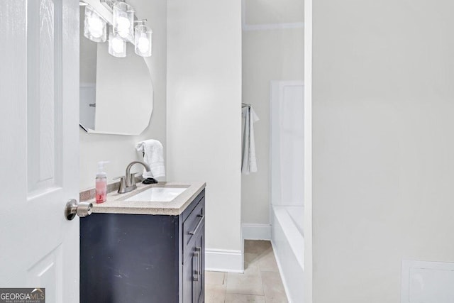 11 Poplar St, Porterdale, GA 30014 - full bath featuring tile patterned floors, vanity, a chandelier, and baseboards