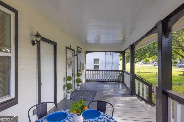 11 Poplar St, Porterdale, GA 30014 - wooden terrace featuring covered porch